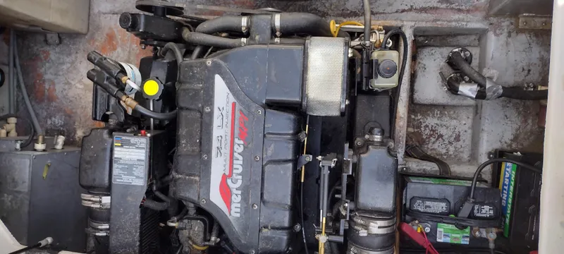 Slide: The Image of 1997 Crownline 250 CR boat engine compartment with MerCruiser engine. - 10
