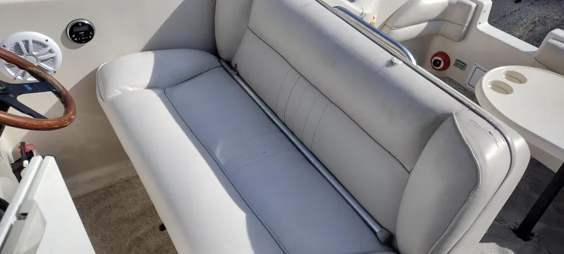 Slide: The Image of 1997 Crownline 250 CR boat interior with white leather seating and steering wheel. - 17