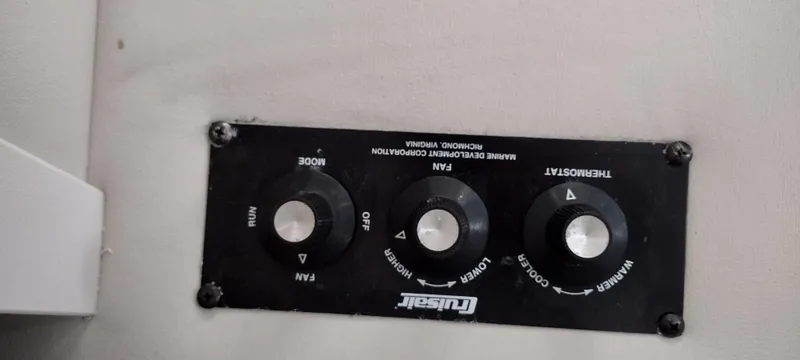 Slide: The Image of Control panel of a 1997 Crownline 250 CR boat with thermostat and fan settings. - 23