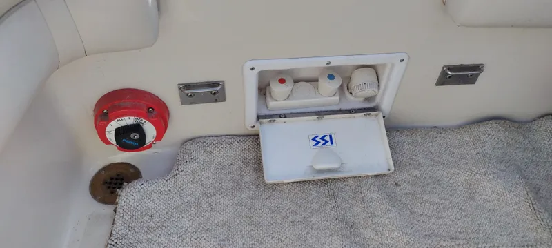 Slide: The Image of Crownline 250 CR 1997 boat interior with control panel and carpet. - 25