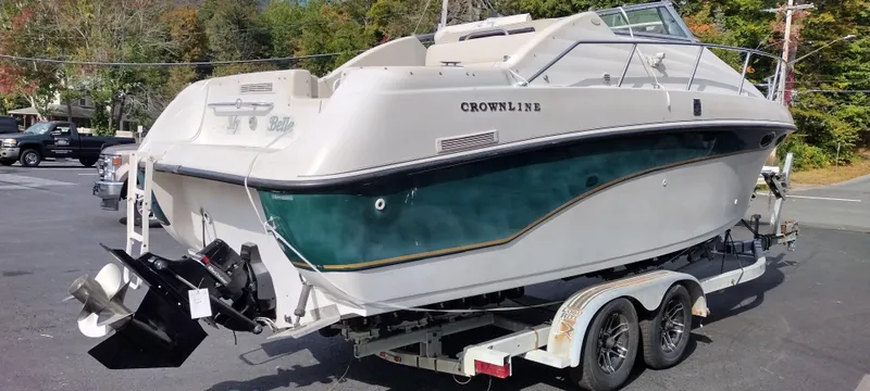 Slide: The Image of 1997 Crownline 250 CR boat on a trailer in a parking lot. - 6