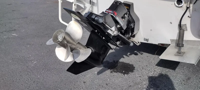 Slide: The Image of Close-up of the propeller and stern drive of a 1997 Crownline 250 CR boat. - 9