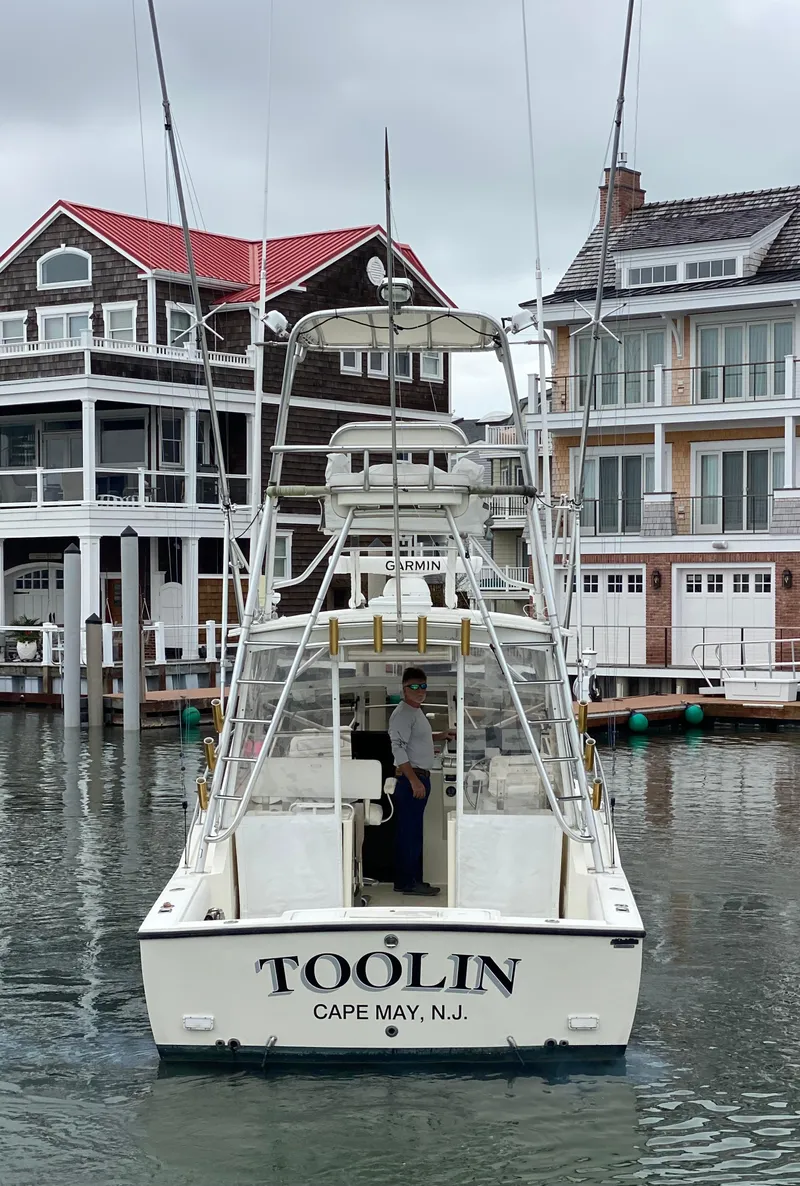 Slide: The Image of 2004 Carolina Classic 28 boat named "Toolin" in Cape May, NJ marina. - 15