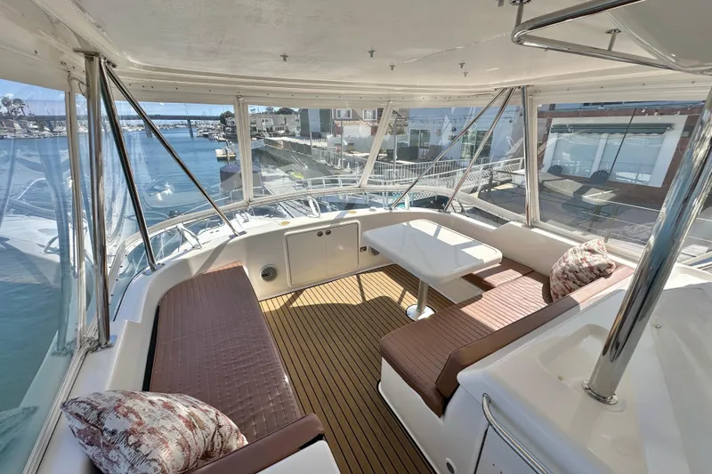 Slide: The Image of Luxurious 2005 Riviera 47 Open Flybridge yacht interior with panoramic marina views. - 14
