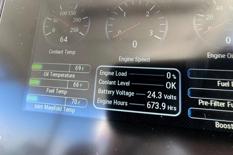 Slide: The Image of Dashboard display of a 2005 Riviera 47 Open Flybridge showing engine metrics and temperatures. - 18