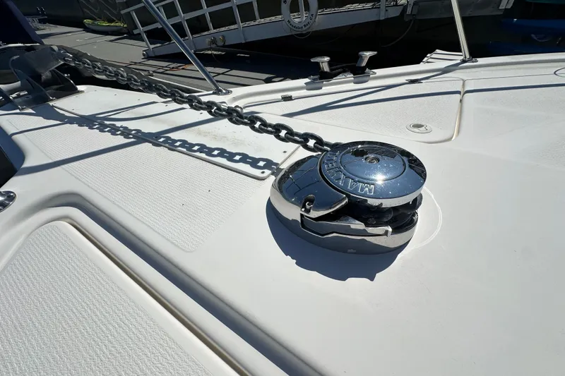 Slide: The Image of Anchor chain and winch on 2005 Riviera 47 Open Flybridge yacht deck. - 21