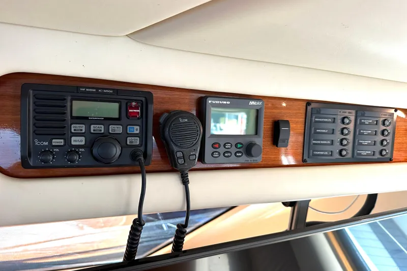 Slide: The Image of Control panel of a 2005 Riviera 47 Open Flybridge with navigation and communication equipment. - 25
