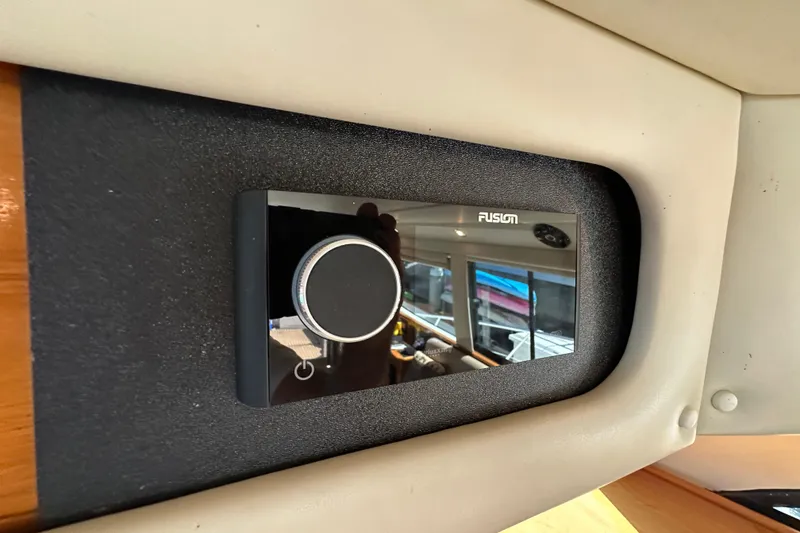 Slide: The Image of Fusion audio control panel on 2005 Riviera 47 Open Flybridge yacht interior. - 26