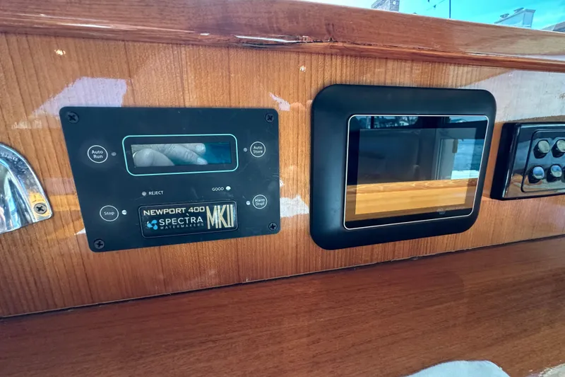 Slide: The Image of Control panel of a 2005 Riviera 47 Open Flybridge yacht with Newport 400 Spectra Watermakers. - 27