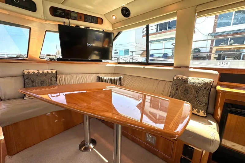 Slide: The Image of Luxurious interior of 2005 Riviera 47 Open Flybridge yacht with plush seating and TV. - 34