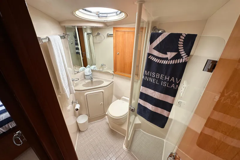 Slide: The Image of Luxurious bathroom in 2005 Riviera 47 Open Flybridge yacht, featuring modern amenities and nautical decor. - 42