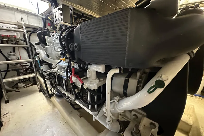 Slide: The Image of Engine room of 2005 Riviera 47 Open Flybridge yacht, showcasing detailed machinery and components. - 51