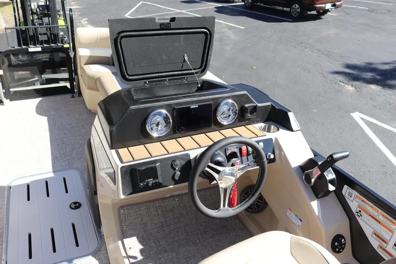 Slide: The Image of 2024 Premier 250 SunSation RF boat dashboard and steering wheel. - 12