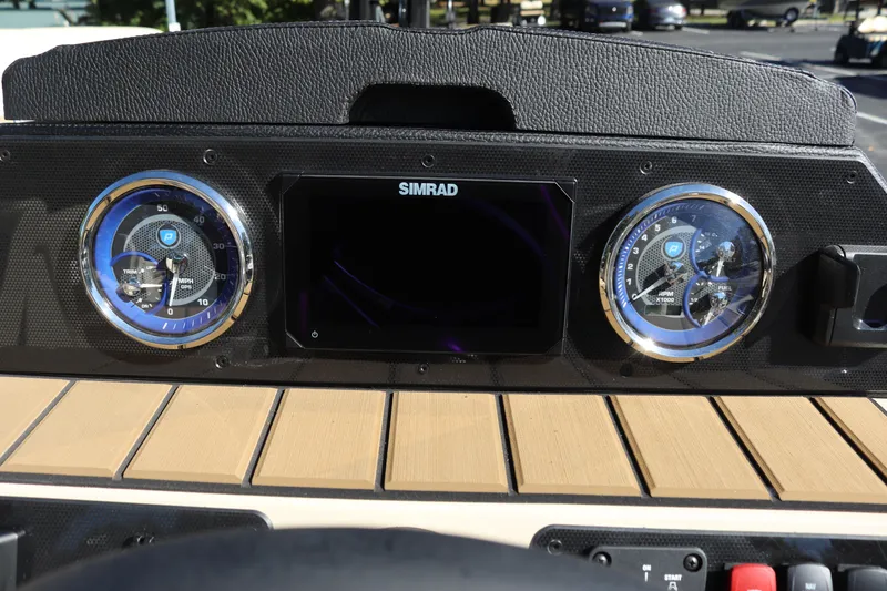 Slide: The Image of 2024 Premier 250 SunSation RF dashboard with Simrad display and analog gauges. - 14