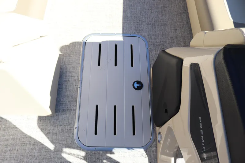 Slide: The Image of 2024 Premier 250 SunSation RF boat interior with storage compartment and seating. - 21