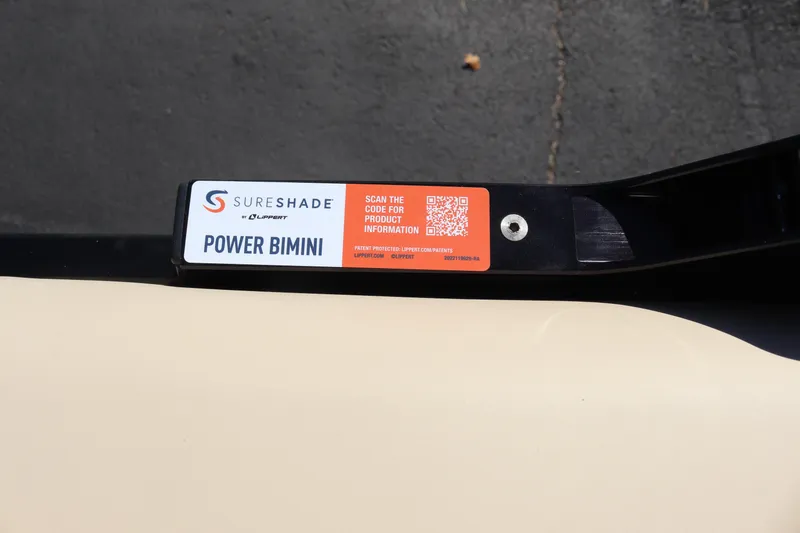 Slide: The Image of 2024 Premier 250 SunSation RF SureShade Power Bimini label with QR code for product information. - 22