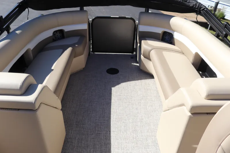 Slide: The Image of 2024 Premier 250 SunSation RF boat interior with beige seating and spacious layout. - 7