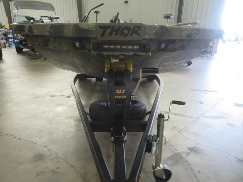Slide: The Image of 2024 Thor SWAMP HAMMER 1754 DELUXE boat on trailer in warehouse. - 9