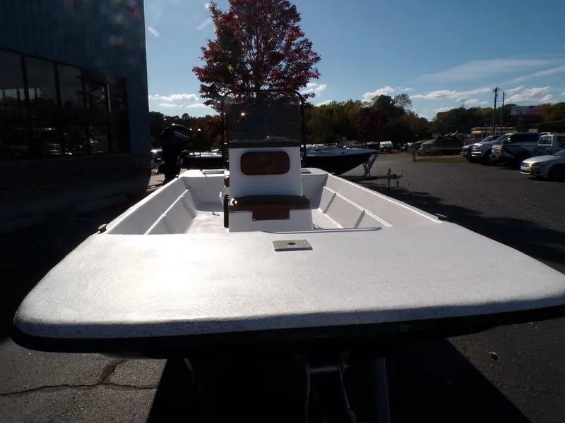 Slide: The Image of 2024 Custom 1800 Tunnel boat in a parking lot, front view. - 12