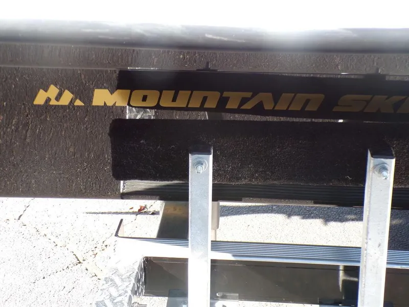 Slide: The Image of Custom 1800 Tunnel 2024 trailer with Mountain Ski branding. - 15