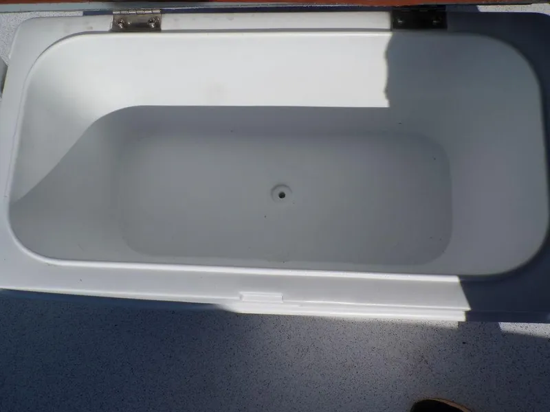 Slide: The Image of 2024 Custom 1800 Tunnel boat storage compartment, open and empty. - 19