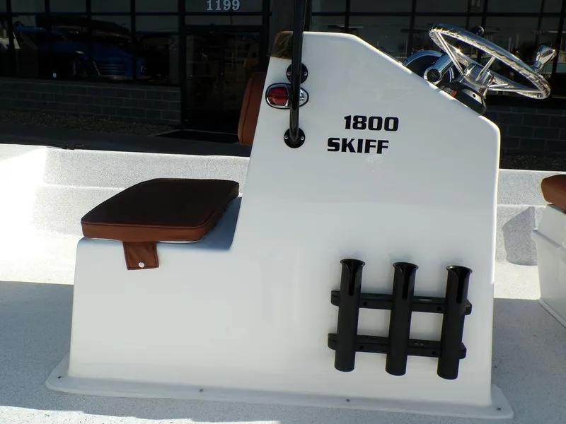 Slide: The Image of 2024 Custom 1800 Tunnel Skiff boat console with seat and rod holders. - 22