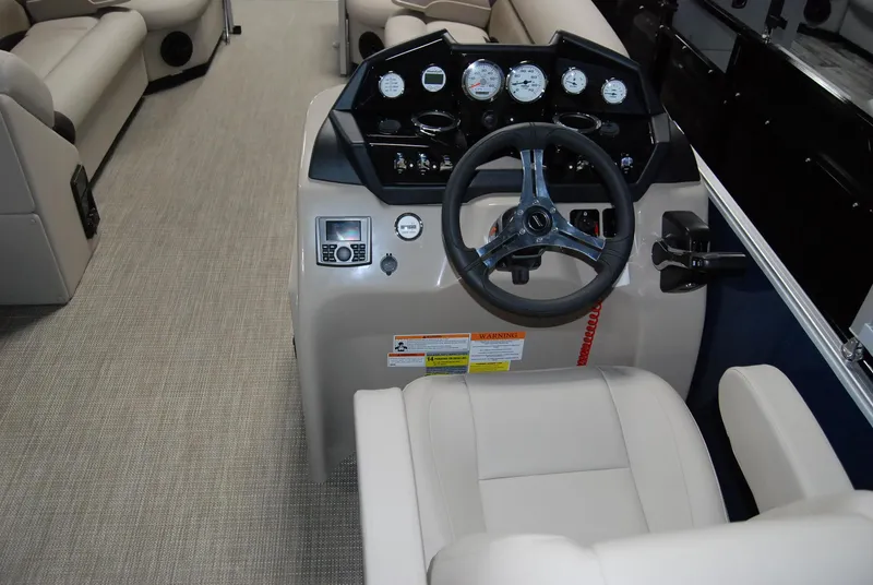 Slide: The Image of 2024 Landau Island Breeze 252 boat cockpit with steering wheel and control panel. - 4