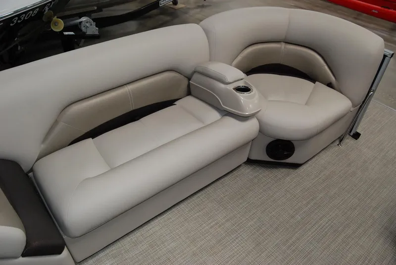 Slide: The Image of 2024 Landau Island Breeze 252 boat interior seating with cup holder. - 8
