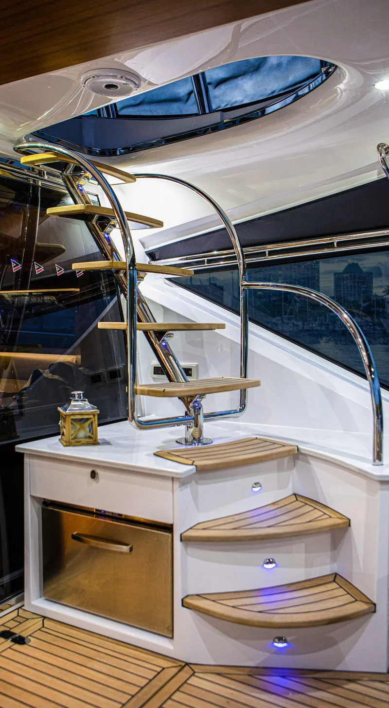 Slide: The Image of Luxurious interior of the 2024 Belize 54 Daybridge yacht with elegant wooden steps. - 11