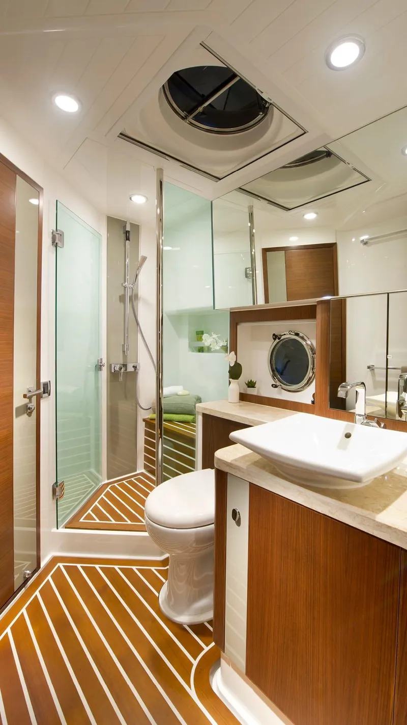 Slide: The Image of Luxurious bathroom in 2024 Belize 54 Daybridge yacht with modern fixtures and wooden accents. - 17