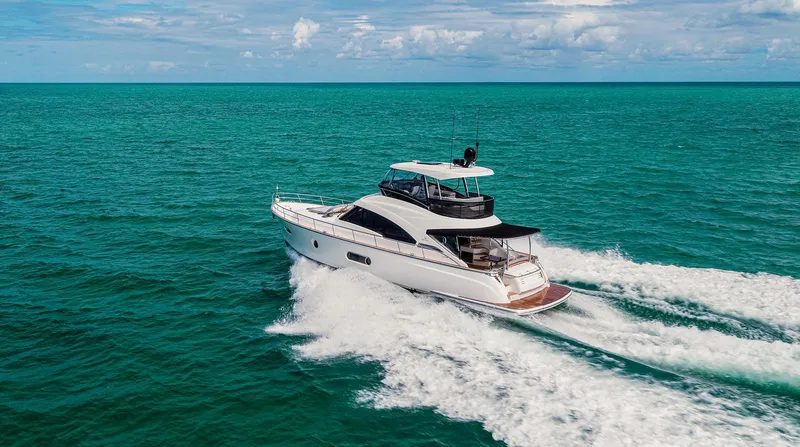 Slide: The Image of 2024 Belize 54 Daybridge yacht cruising on open water. - 3