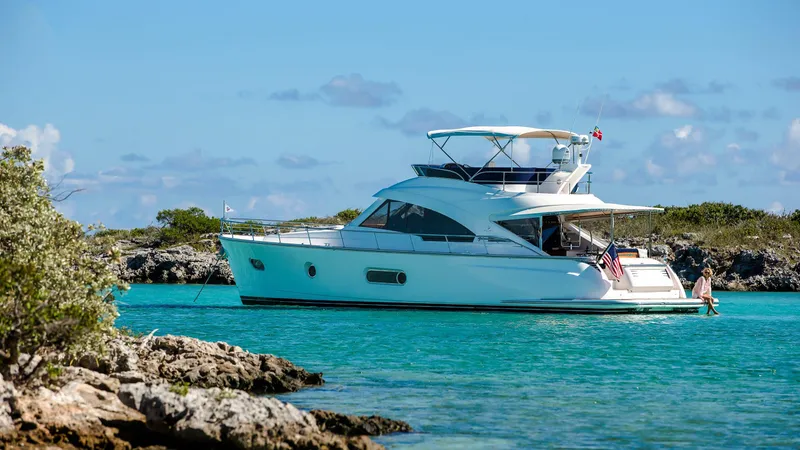 Slide: The Image of 2024 Belize 54 Daybridge yacht anchored in clear turquoise waters. - 4