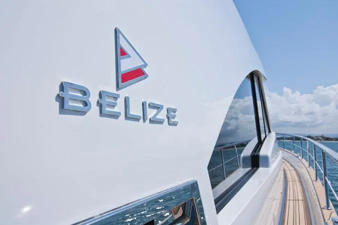 Slide: The Image of 2024 Belize 54 Sedan yacht on open water. - 2