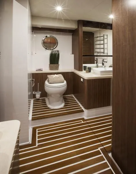 Slide: The Image of Luxurious bathroom in 2024 Belize 66 Sedan yacht with modern wood accents and sleek fixtures. - 18