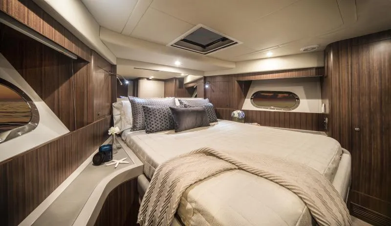 Slide: The Image of Luxurious bedroom interior of 2024 Belize 66 Sedan yacht with modern design and cozy bedding. - 21