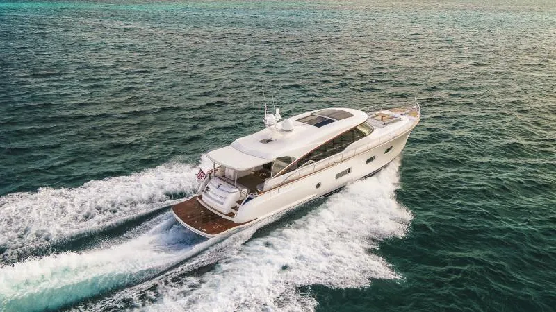 Slide: The Image of 2024 Belize 66 Sedan yacht cruising on open water. - 4
