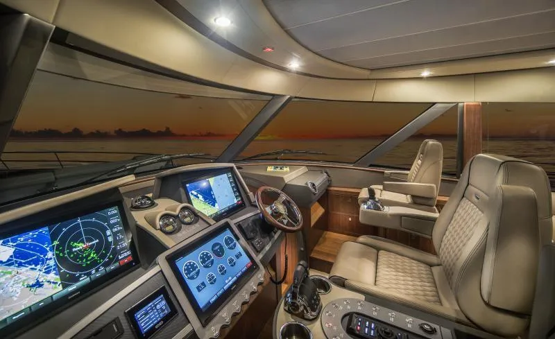 Slide: The Image of Luxurious cockpit of the 2024 Belize 66 Sedan yacht at sunset. - 9