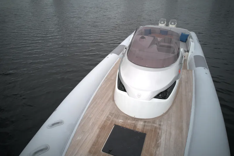 Slide: The Image of 2014 SACS Strider 13 luxury inflatable boat on calm water. - 13