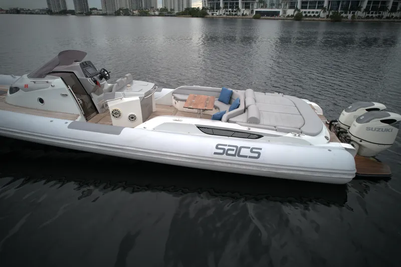 Slide: The Image of 2014 SACS Strider 13 luxury inflatable boat on calm water. - 14