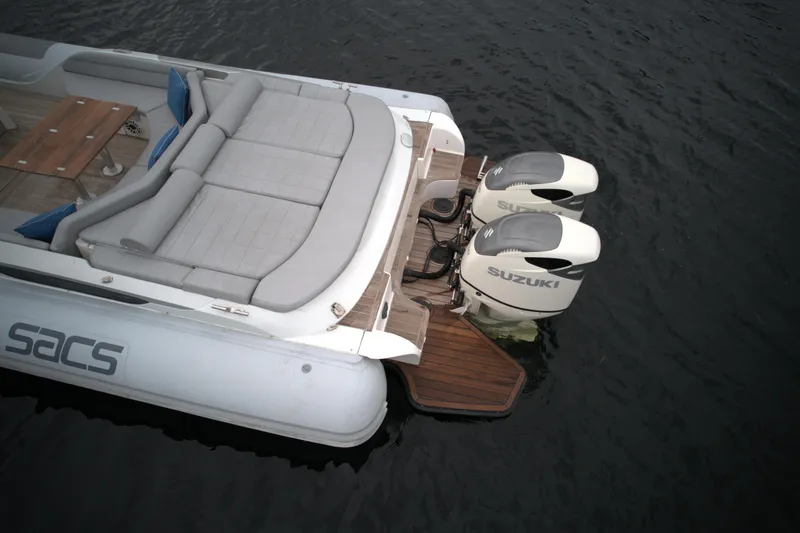 Slide: The Image of 2014 SACS Strider 13 boat with twin Suzuki outboard engines. - 15