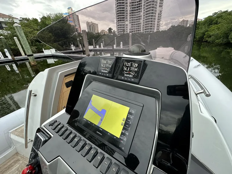 Slide: The Image of Control panel of a 2014 SACS Strider 13 boat with navigation display. - 18