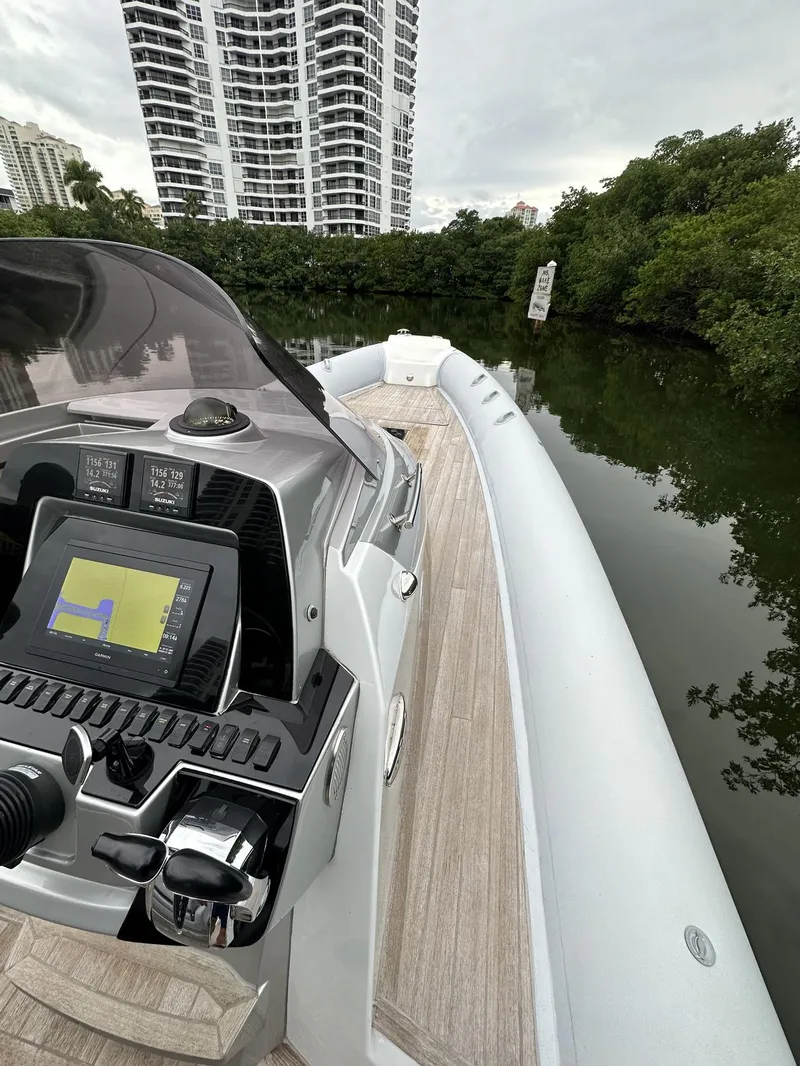 Slide: The Image of 2014 SACS Strider 13 boat with modern navigation system on a calm waterway. - 20