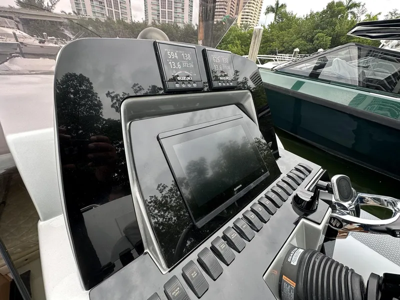 Slide: The Image of 2014 SACS Strider 13 dashboard with navigation and control systems. - 23