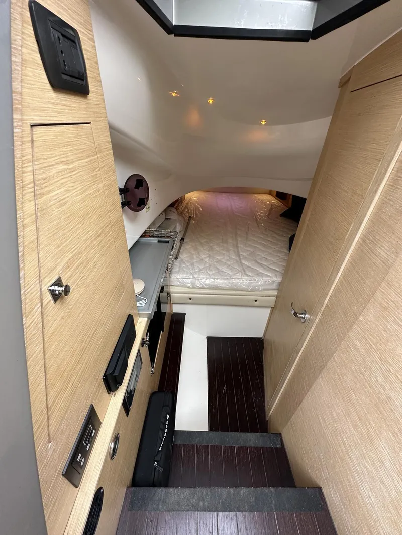 Slide: The Image of Interior cabin of a 2014 SACS Strider 13 boat with modern amenities. - 30