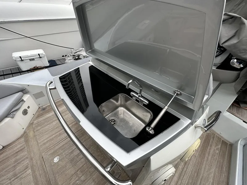 Slide: The Image of 2014 SACS Strider 13 boat sink and countertop area. - 32