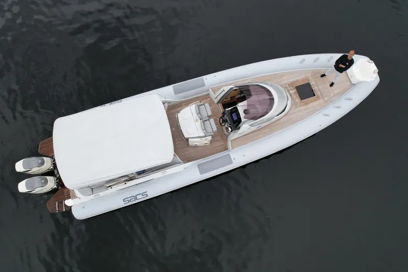 Slide: The Image of Aerial view of a 2014 SACS Strider 13 boat on water. - 37