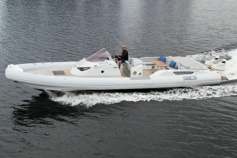Slide: The Image of 2014 SACS Strider 13 boat cruising on water. - 41