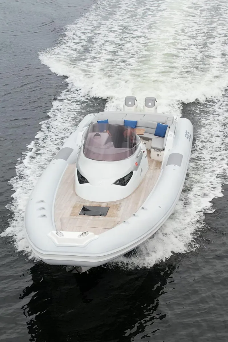 Slide: The Image of 2014 SACS Strider 13 luxury inflatable boat cruising on water. - 42
