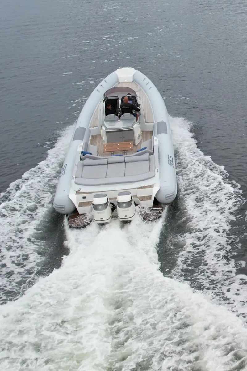 Slide: The Image of 2014 SACS Strider 13 inflatable boat cruising on water. - 44