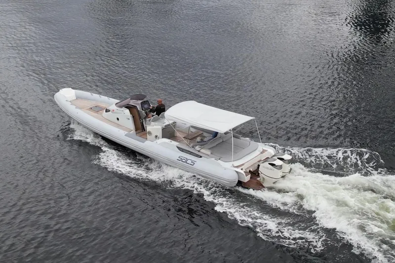 Slide: The Image of 2014 SACS Strider 13 boat cruising on water. - 45